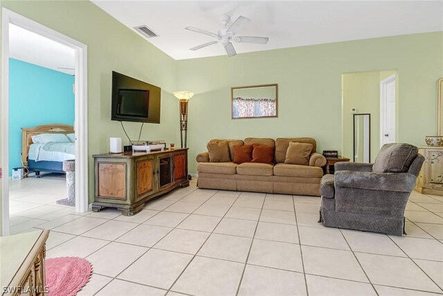 living room featuring ceiling fan and light tile patterned flooring