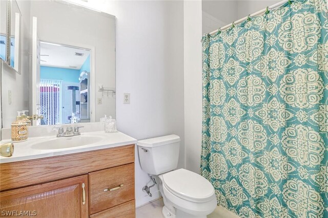 bathroom with vanity and toilet