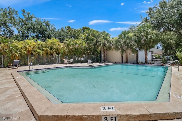 view of pool featuring a patio