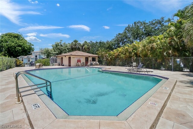 view of swimming pool featuring a patio area