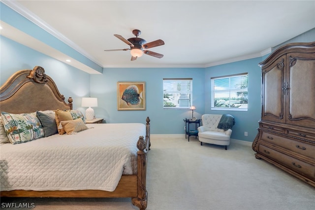 bedroom with ceiling fan, carpet floors, and ornamental molding