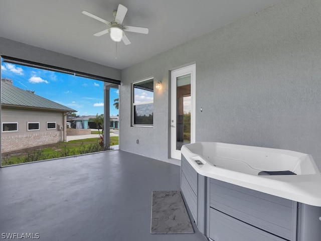 view of patio featuring ceiling fan