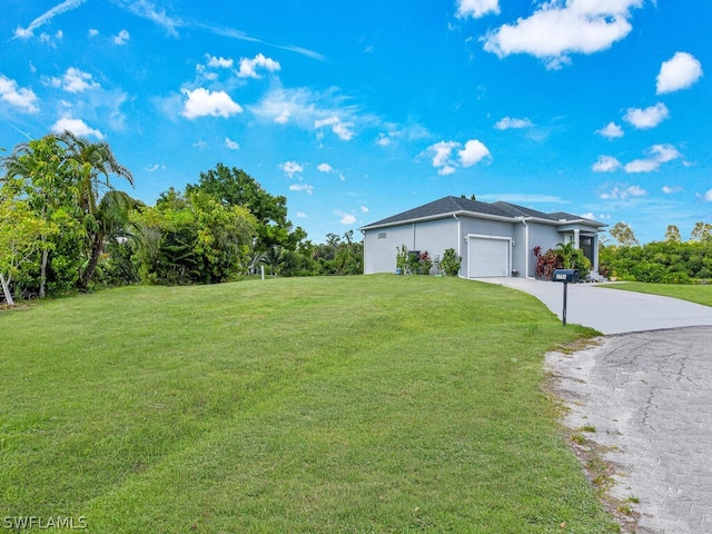 exterior space with a front lawn and a garage