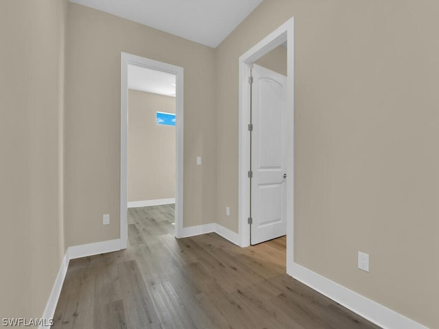 spare room with light hardwood / wood-style flooring