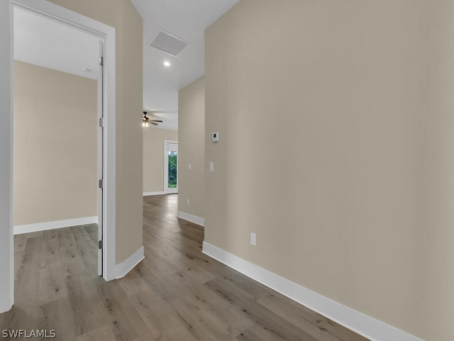 corridor featuring light wood-type flooring