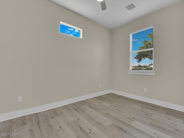 unfurnished room with ceiling fan and light hardwood / wood-style flooring