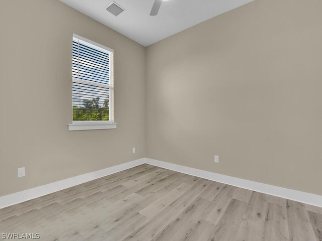 unfurnished room with ceiling fan and light hardwood / wood-style flooring