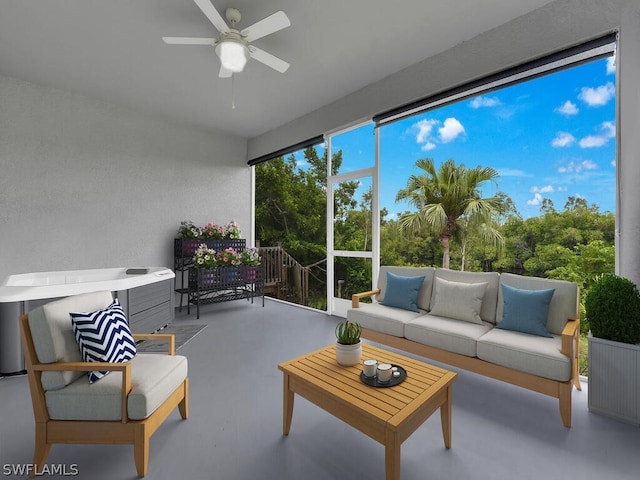 sunroom featuring ceiling fan