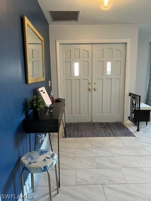 entryway featuring visible vents