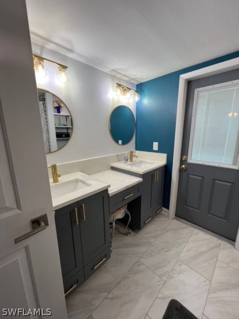 bathroom with tile floors and double sink vanity