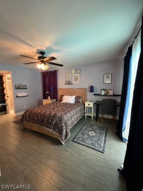 bedroom with ceiling fan and hardwood / wood-style flooring