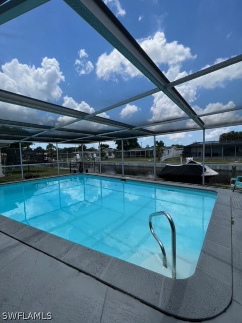 view of pool with a lanai