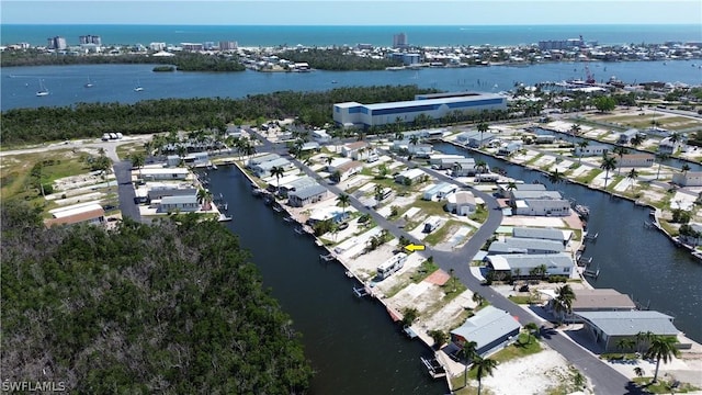 drone / aerial view with a residential view and a water view