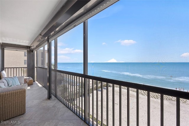 balcony featuring a water view and outdoor lounge area