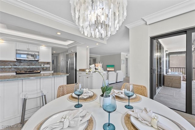 dining area featuring crown molding