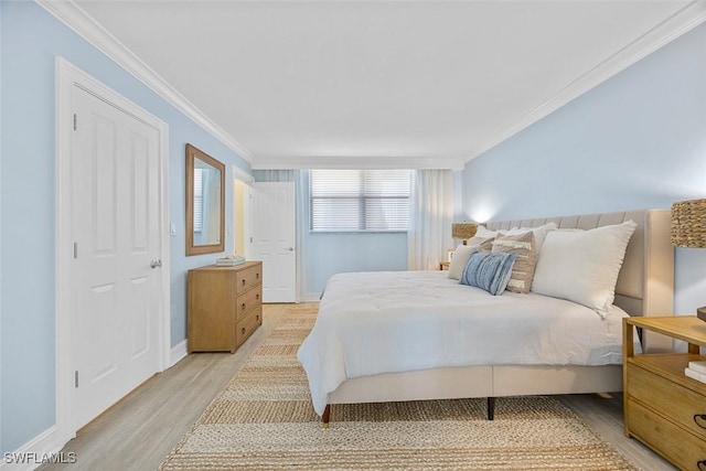 bedroom featuring light hardwood / wood-style floors and ornamental molding