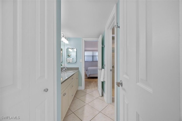 bathroom with vanity and tile patterned flooring