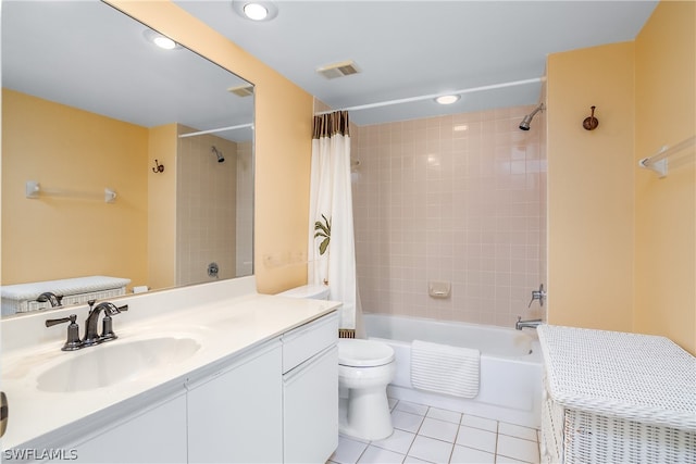 full bathroom featuring tile patterned floors, vanity, toilet, and shower / tub combo with curtain