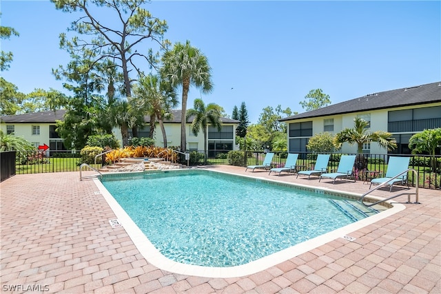 view of swimming pool featuring a patio area