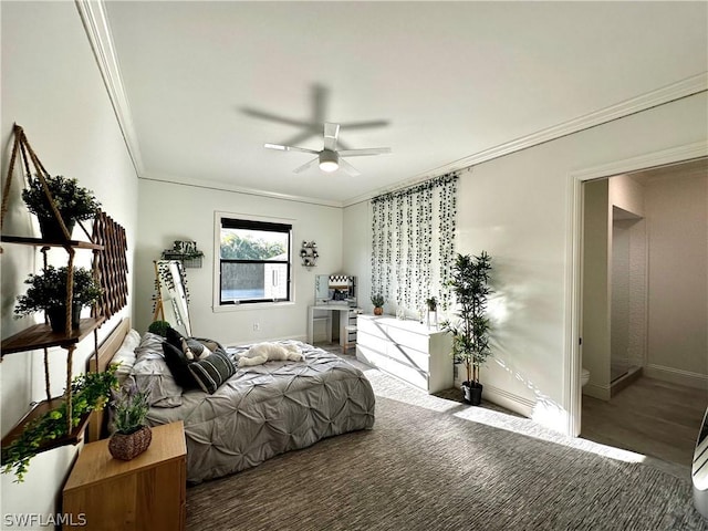 bedroom with carpet, ceiling fan, and crown molding