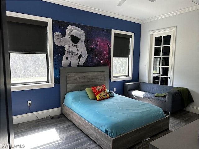 bedroom with hardwood / wood-style flooring, ceiling fan, and ornamental molding