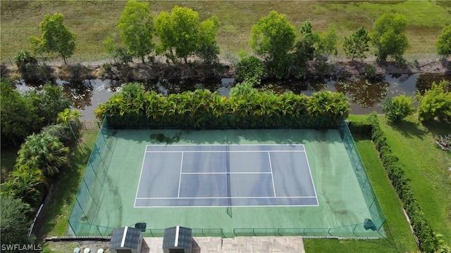 view of sport court with a water view