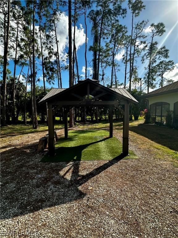 view of community with a gazebo and a lawn