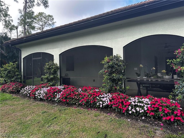 view of property exterior featuring a lawn