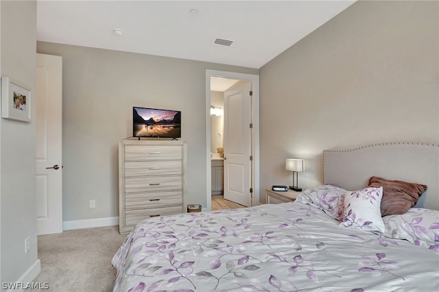 bedroom with light carpet and vaulted ceiling