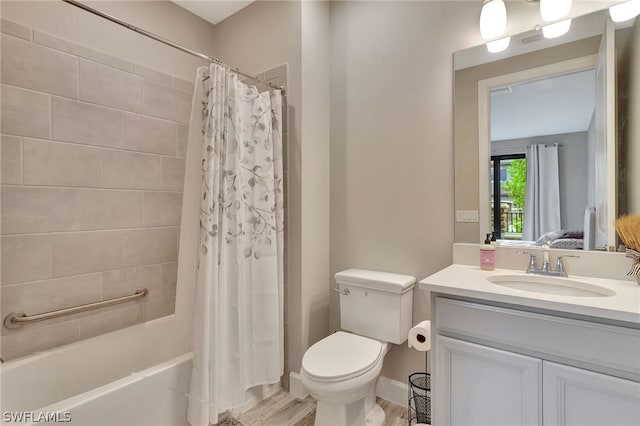 full bathroom featuring toilet, wood-type flooring, vanity, and shower / tub combo with curtain