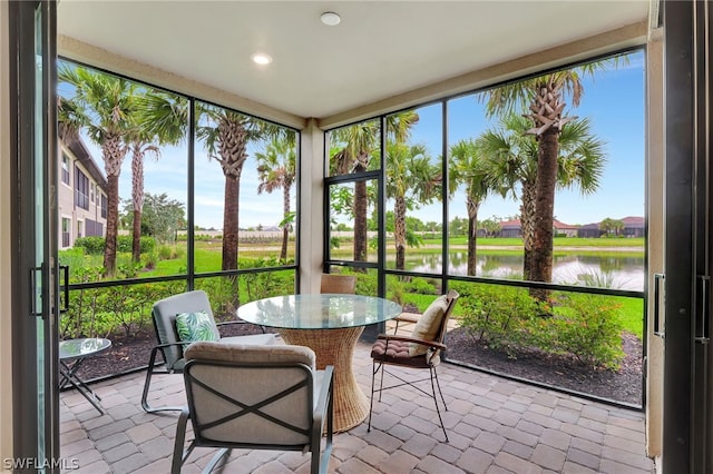 sunroom with a water view