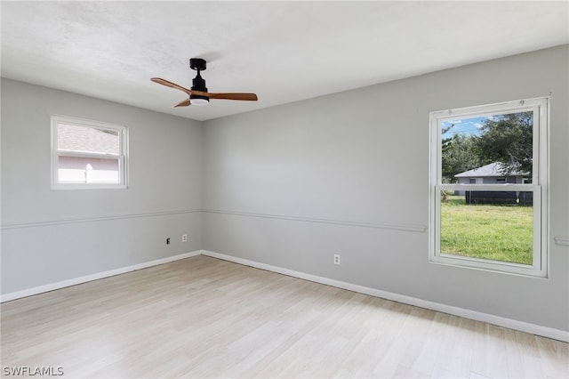 unfurnished room featuring light hardwood / wood-style flooring and ceiling fan