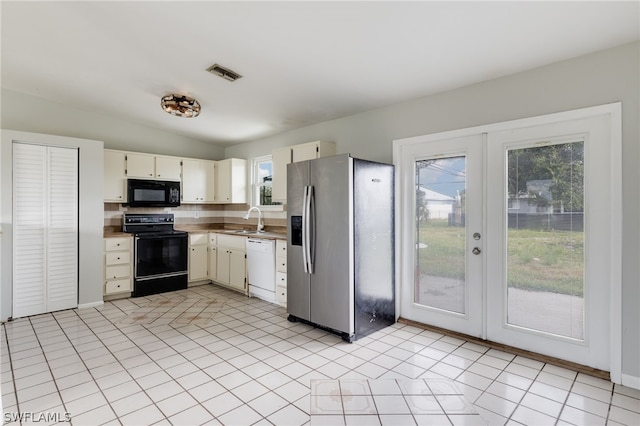 kitchen with a healthy amount of sunlight, french doors, black appliances, and sink