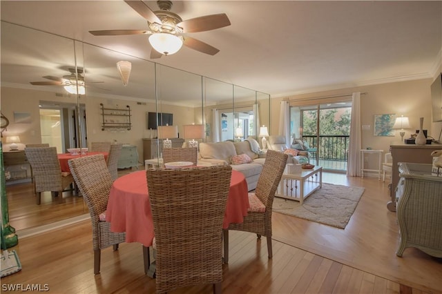 dining room featuring light hardwood / wood-style floors, ceiling fan, and ornamental molding