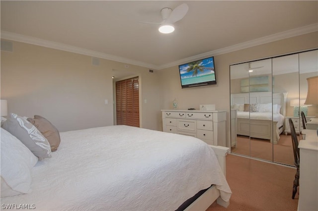 carpeted bedroom featuring ceiling fan and crown molding