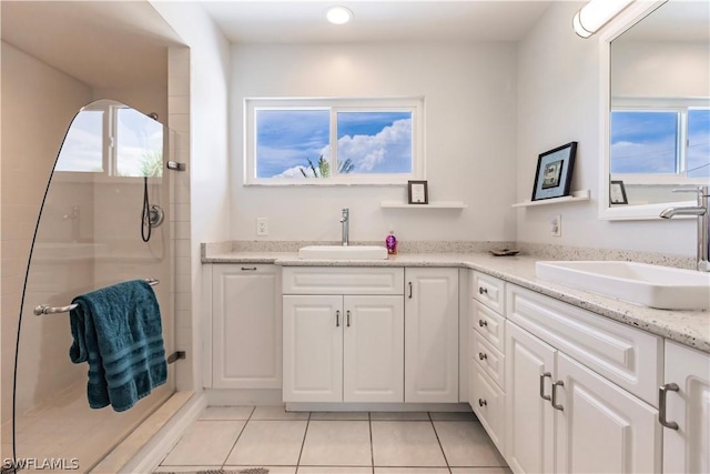 bathroom with vanity, tile patterned floors, and walk in shower