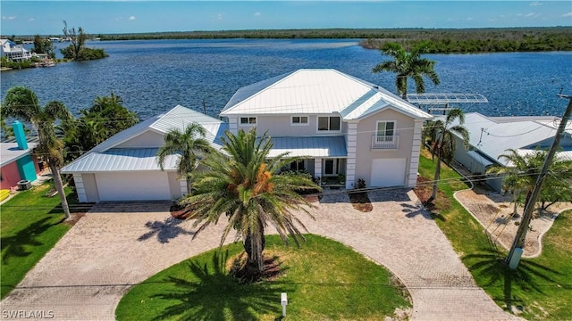 birds eye view of property with a water view