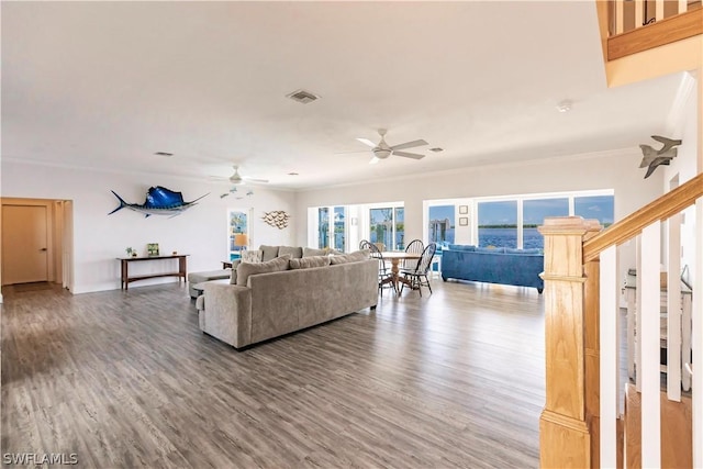 living room featuring ceiling fan, crown molding, and hardwood / wood-style floors