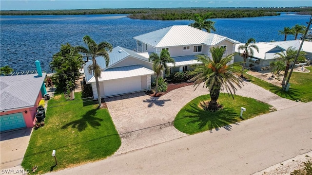 birds eye view of property with a water view