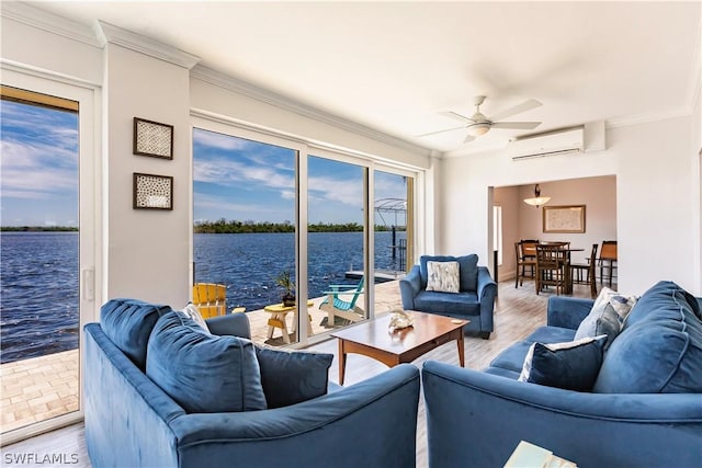 living room with an AC wall unit, wood-type flooring, a water view, ceiling fan, and crown molding