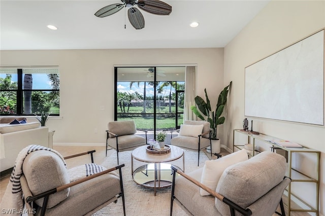 living room featuring ceiling fan and light carpet