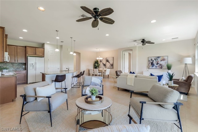 living room with ceiling fan and light tile patterned flooring