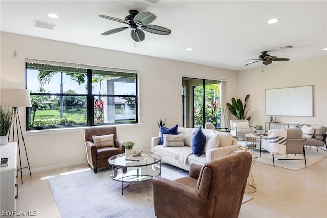 living room featuring plenty of natural light and light tile patterned floors