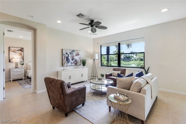 tiled living room featuring ceiling fan