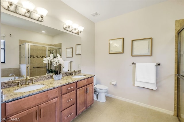 bathroom with vanity, toilet, and a shower with door