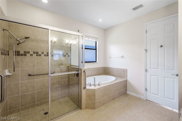 bathroom featuring tile patterned flooring and independent shower and bath