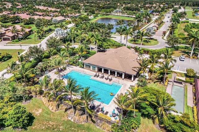 birds eye view of property with a water view