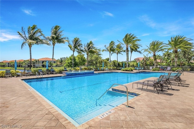 view of pool featuring a patio