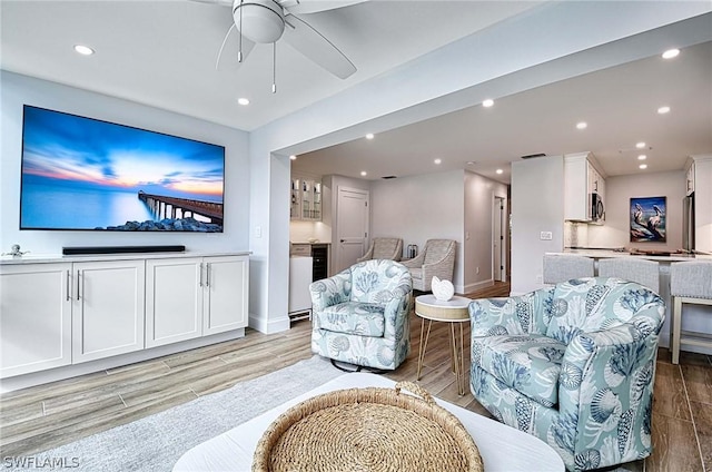 living room featuring ceiling fan