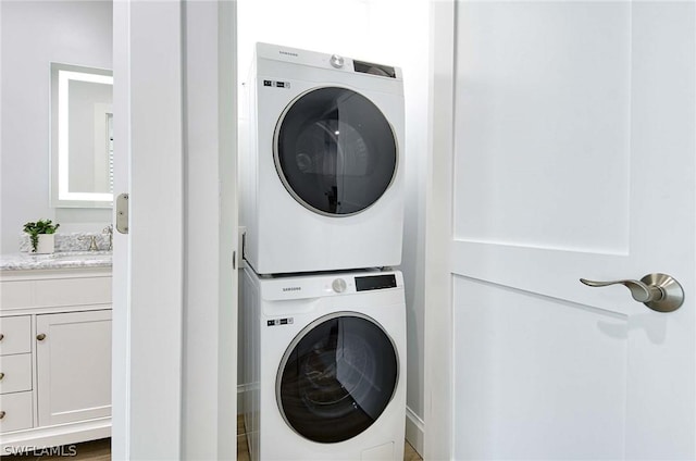 laundry room with stacked washer and clothes dryer